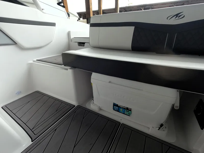 Slide: The Image of 2023 Monterey M-22 boat interior with seating and storage. - 19