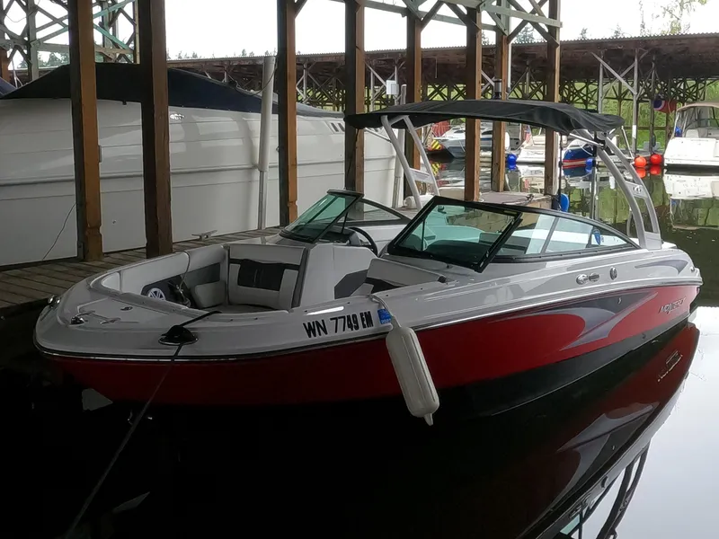 Slide: The Image of 2023 Monterey M-22 boat docked in a marina. - 23