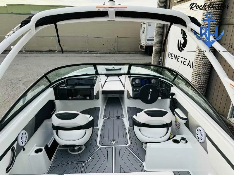 Slide: The Image of 2023 Monterey M-22 boat interior with modern seating and dashboard. - 25