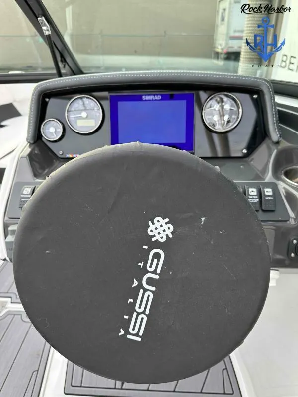 Slide: The Image of Monterey M-22 2023 boat dashboard with Gussi Italia steering wheel and Simrad display. - 26