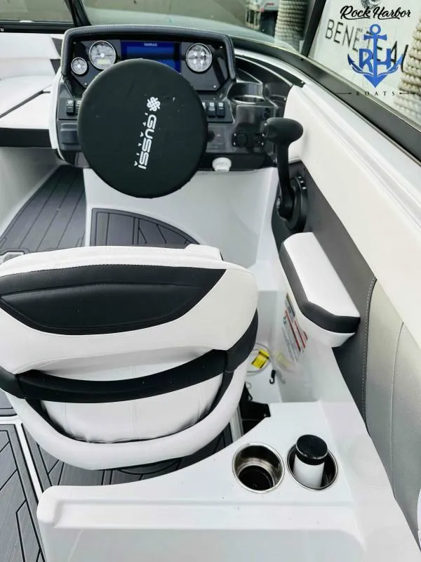Slide: The Image of 2023 Monterey M-22 boat cockpit with Gussi steering wheel and modern controls. - 28