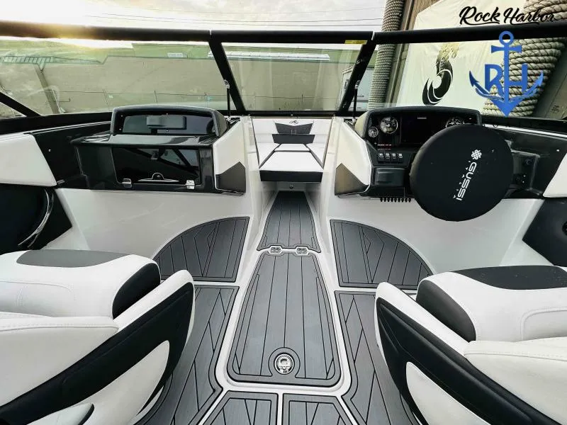 Slide: The Image of 2023 Monterey M-22 boat interior with modern dashboard and seating at Rock Harbor. - 32