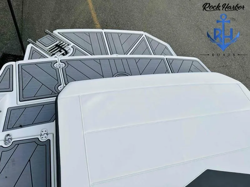 Slide: The Image of 2023 Monterey M-22 boat deck with Rock Harbor Boats logo. - 36