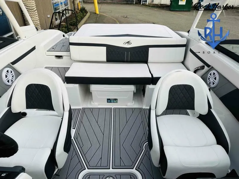 Slide: The Image of 2023 Monterey M-22 boat interior with white and black seating, modern design. - 43