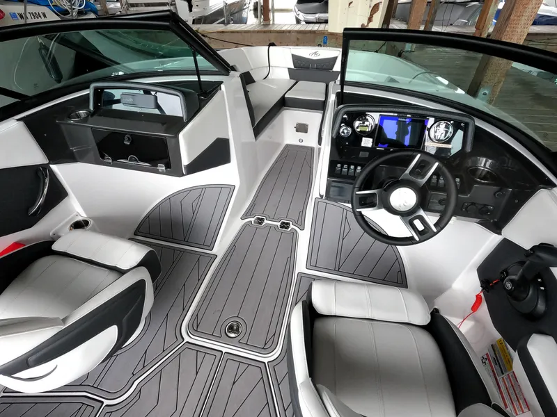 Slide: The Image of Interior of 2023 Monterey M-22 boat with modern dashboard and seating. - 44