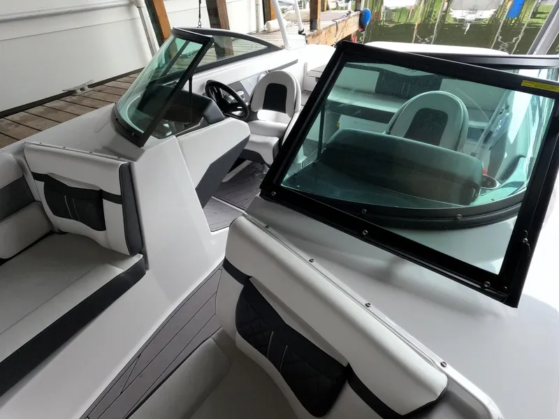 Slide: The Image of 2023 Monterey M-22 boat interior with seating and windshield. - 48