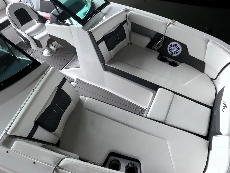 Slide: The Image of 2023 Monterey M-22 boat interior with white and black seating, modern design. - 5