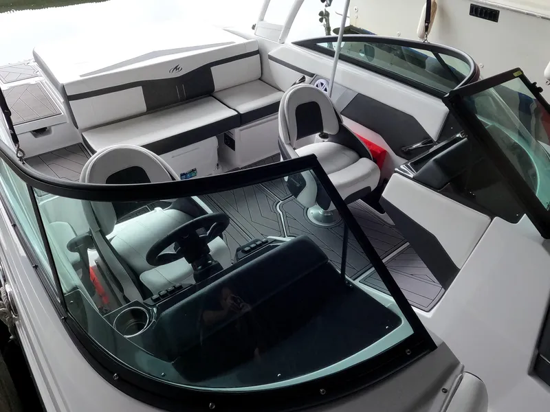 Slide: The Image of 2023 Monterey M-22 boat interior with modern seating and steering console. - 7