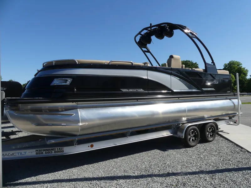 The Image of 2023 Silver Wave 2610 CLS SW7 pontoon boat on a trailer. - 0