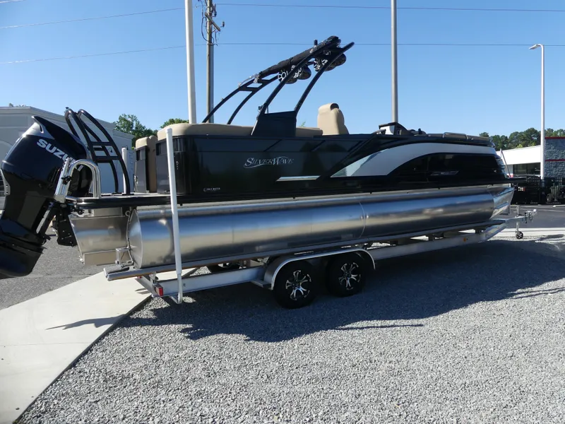 Slide: The Image of 2023 Silver Wave 2610 CLS SW7 pontoon boat on a trailer. - 1