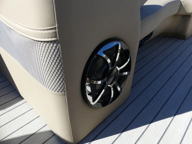 Slide: The Image of 2023 Silver Wave 2610 CLS SW7 boat interior with speaker and cushioned seating. - 13