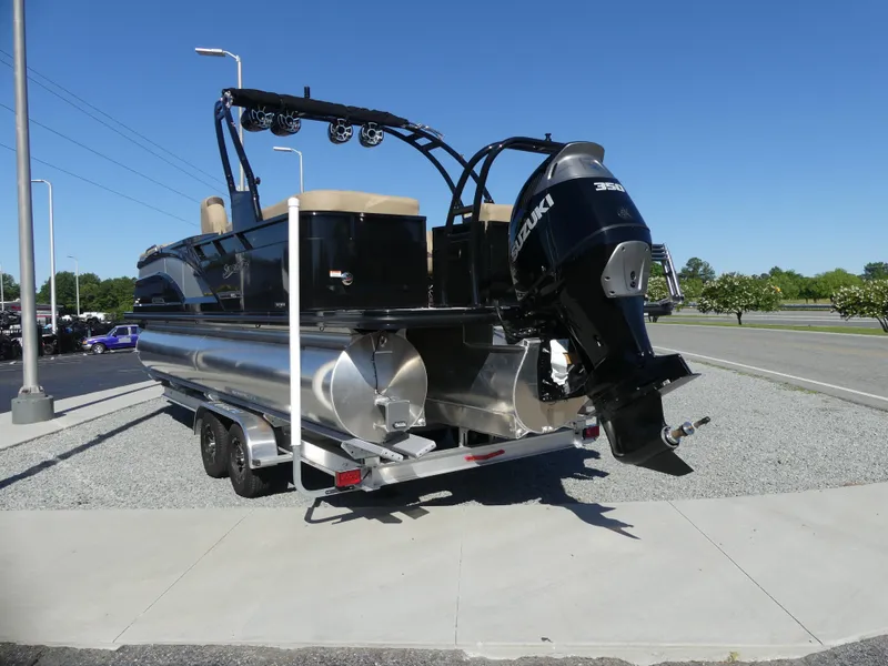 Slide: The Image of 2023 Silver Wave 2610 CLS SW7 pontoon boat with Suzuki outboard motor, rear view. - 2