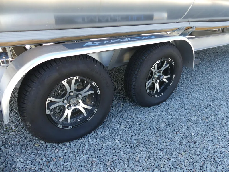Slide: The Image of 2023 Silver Wave 2610 CLS SW7 trailer wheels on gravel. - 23