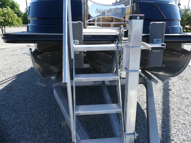 Slide: The Image of 2023 Silver Wave 2610 CLS SW7 pontoon boat rear view with boarding ladder. - 5