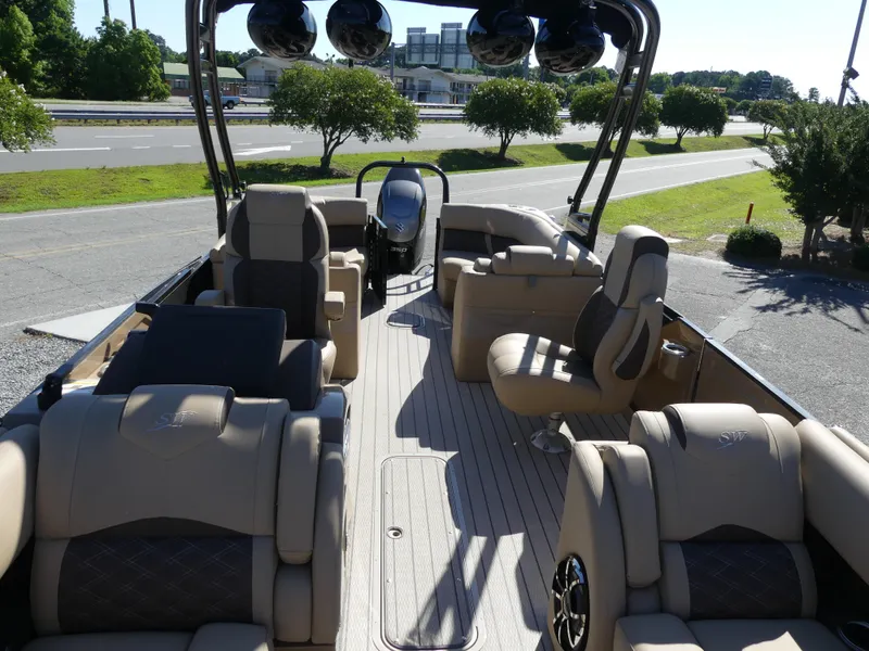 Slide: The Image of 2023 Silver Wave 2610 CLS SW7 pontoon boat with luxurious seating and modern design. - 7
