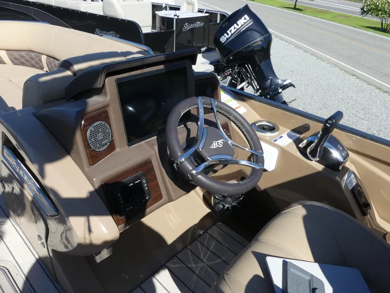 Slide: The Image of 2023 Silver Wave 2610 CLS SW7 boat dashboard with steering wheel and control panel. - 9