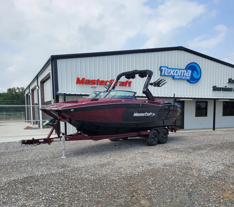 Slide: The Image of 2023 MasterCraft XStar S boat on trailer at Texoma Boathouse. - 18