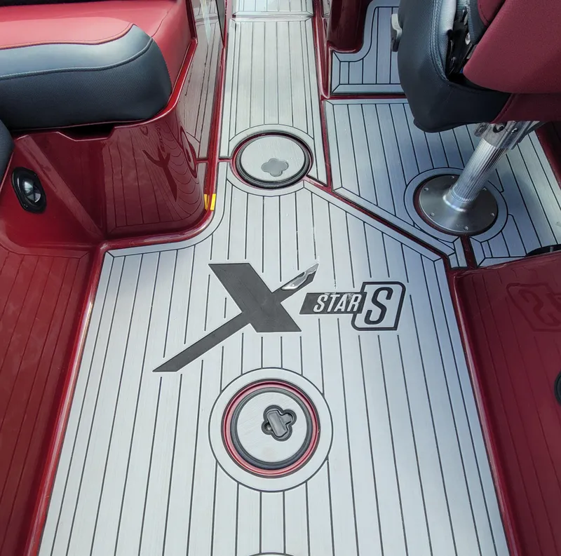 Slide: The Image of 2023 MasterCraft XStar S boat interior with custom flooring design. - 8