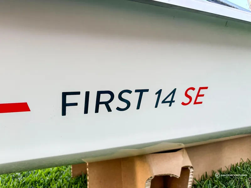 Slide: The Image of 2024 Beneteau First 14 SE sailboat logo on hull. - 8