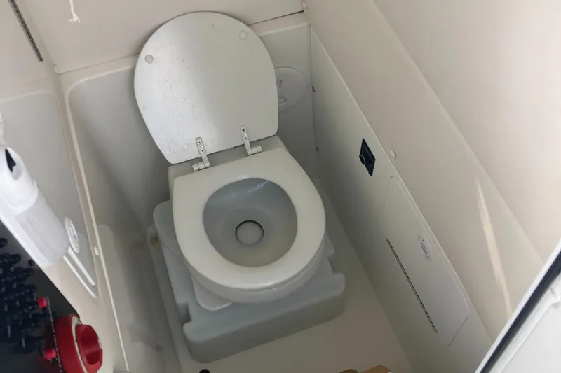 Slide: The Image of 2020 Regulator 23 Forward Seating boat toilet compartment. - 8