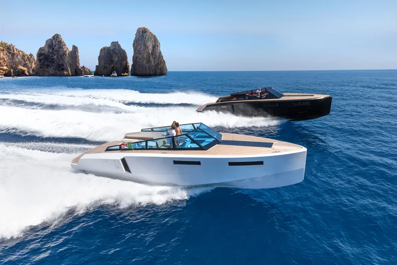 Slide: The Image of 2024 Evo Yachts R4 models cruising on the ocean near rocky cliffs. - 13