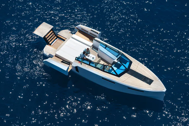 Slide: The Image of 2024 Evo Yachts R4 luxury yacht cruising on open blue water. - 15