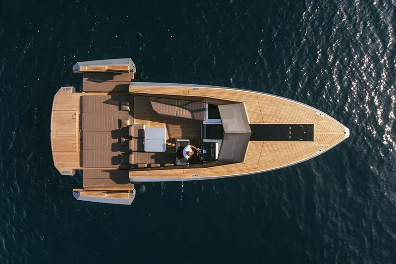 Slide: The Image of Aerial view of 2024 Evo Yachts R4 model on calm water. - 16