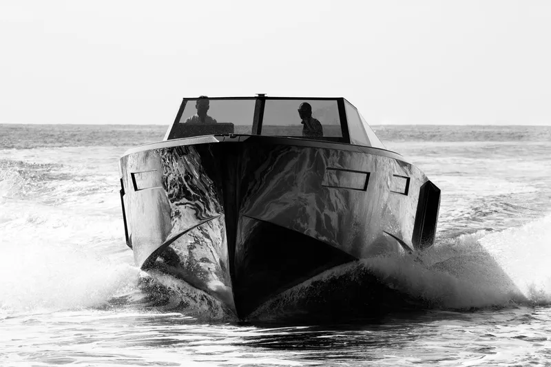 Slide: The Image of 2024 Evo Yachts R4 cruising on the water, front view. - 22