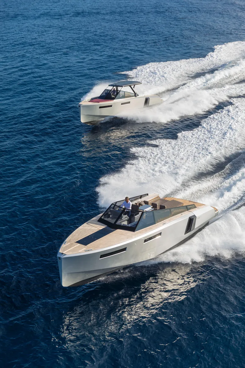 Slide: The Image of Two 2024 Evo Yachts R4 models cruising on the open sea. - 27