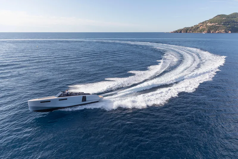 Slide: The Image of 2024 Evo Yachts R4 cruising on open water, leaving a wake trail. - 28