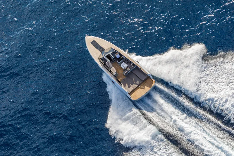 Slide: The Image of Aerial view of 2024 Evo Yachts R4 cruising on blue ocean waters. - 29