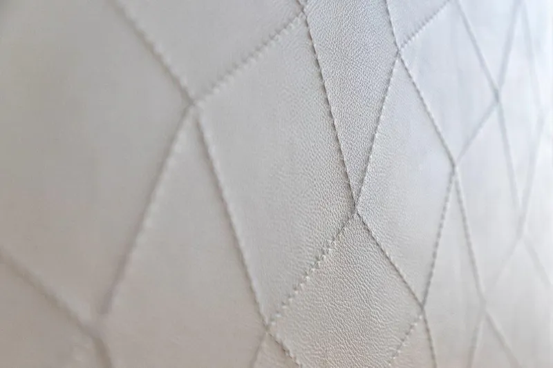 Slide: The Image of Close-up of diamond-stitched leather upholstery on 2025 Evo Yachts V8. - 16