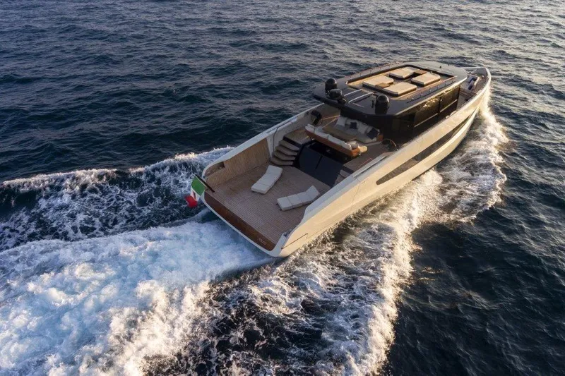 Slide: The Image of Evo Yachts V8 2025 model cruising on open water, rear view. - 2