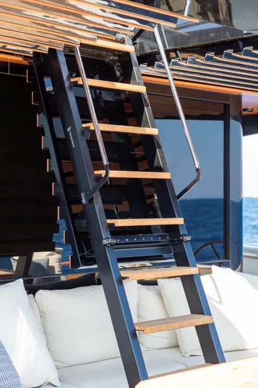 Slide: The Image of Staircase on Evo Yachts V8 2025 model with ocean view. - 22