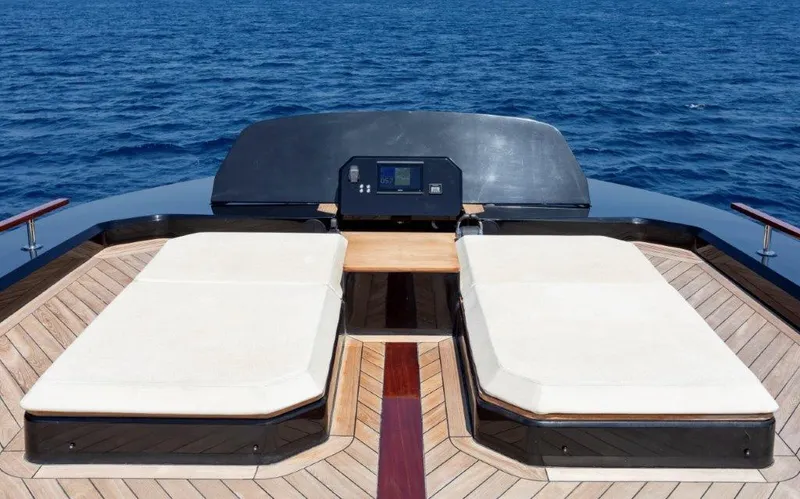 Slide: The Image of Luxury Evo Yachts V8 2025 model with sunbeds on deck, cruising on open sea. - 23