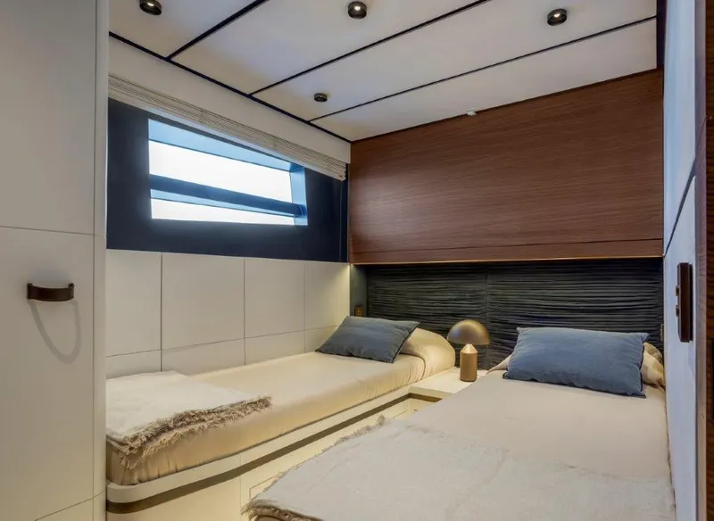 Slide: The Image of Modern twin bedroom on 2025 Evo Yachts V8 with sleek design and natural light. - 28