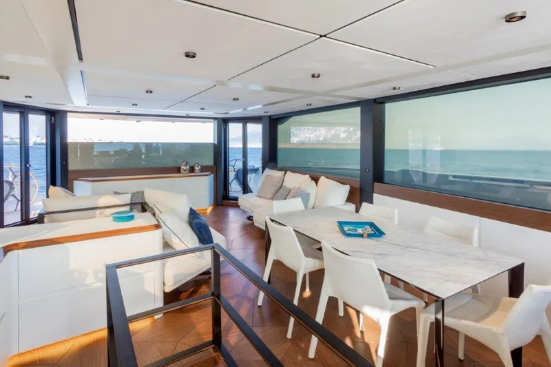 Slide: The Image of Luxurious interior of 2025 Evo Yachts V8 with modern dining area and ocean view. - 30