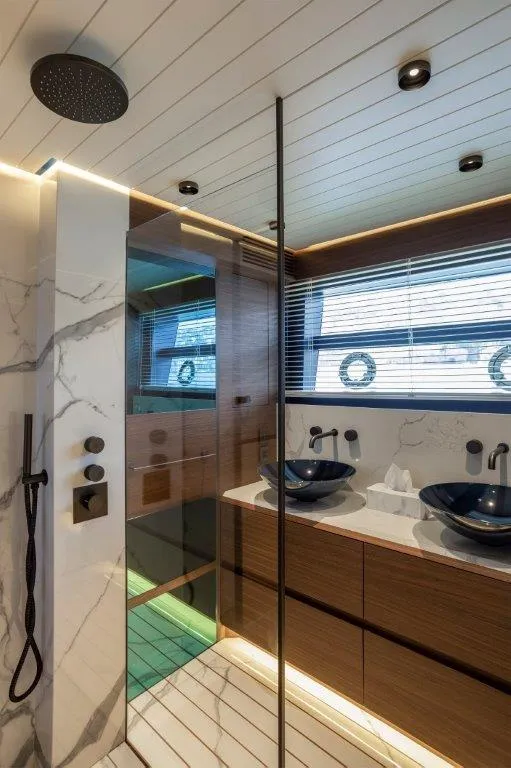Slide: The Image of Luxurious bathroom in 2025 Evo Yachts V8 with modern fixtures and elegant design. - 32