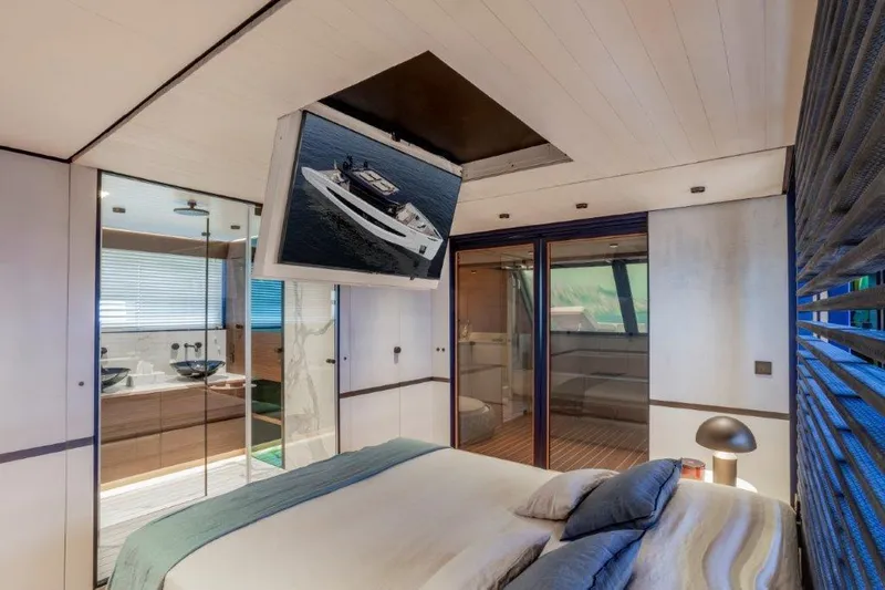 Slide: The Image of Luxurious bedroom interior of 2025 Evo Yachts V8 with ceiling TV and ensuite bathroom. - 34