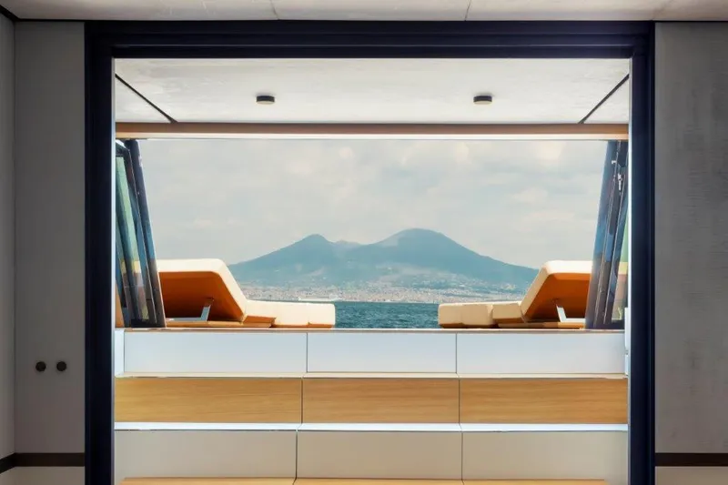 Slide: The Image of 2025 Evo Yachts V8 luxury yacht interior with scenic ocean and mountain view. - 36