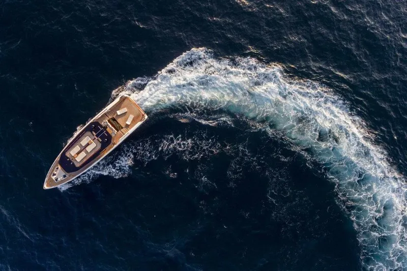 Slide: The Image of Aerial view of 2025 Evo Yachts V8 cruising on the ocean. - 38
