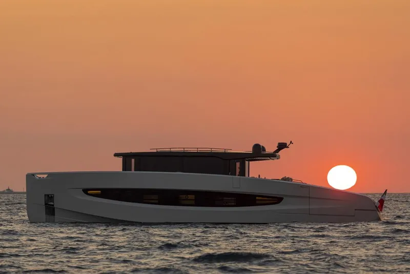 Slide: The Image of Evo Yachts V8 2025 model at sunset on the ocean. - 39