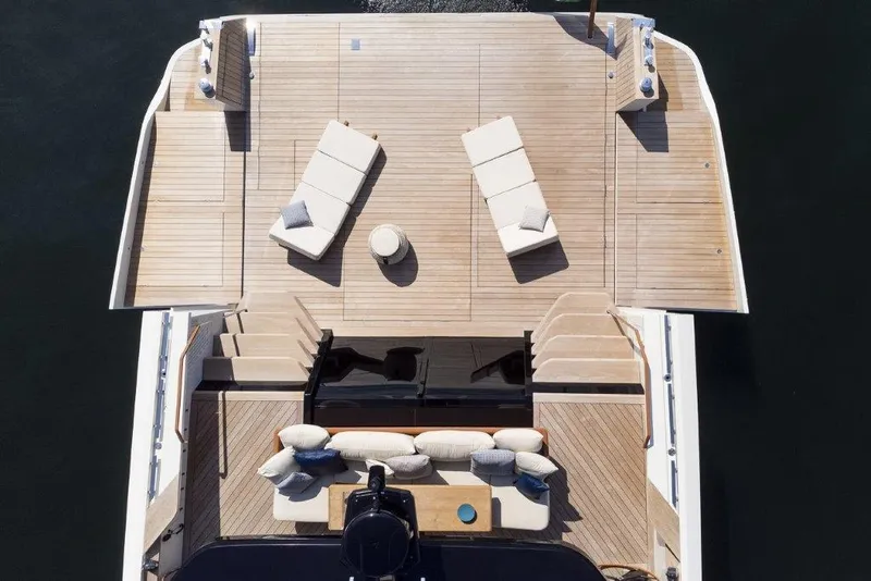 Slide: The Image of 2025 Evo Yachts V8 deck with sun loungers and seating area - 5