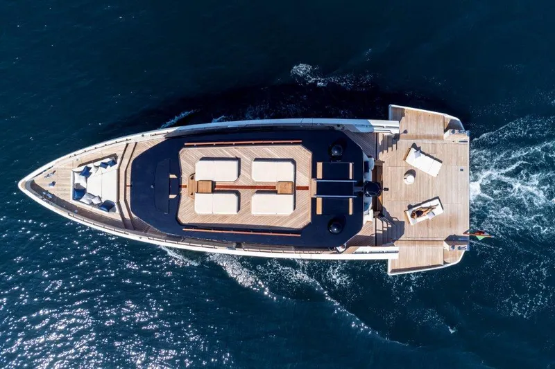Slide: The Image of Aerial view of 2025 Evo Yachts V8 luxury yacht cruising on the ocean. - 9
