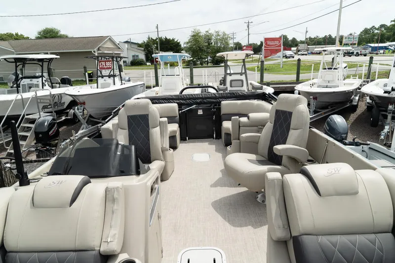 Slide: The Image of 2023 Silver Wave 2410 SW3 CLS pontoon boat interior with luxurious seating. - 11