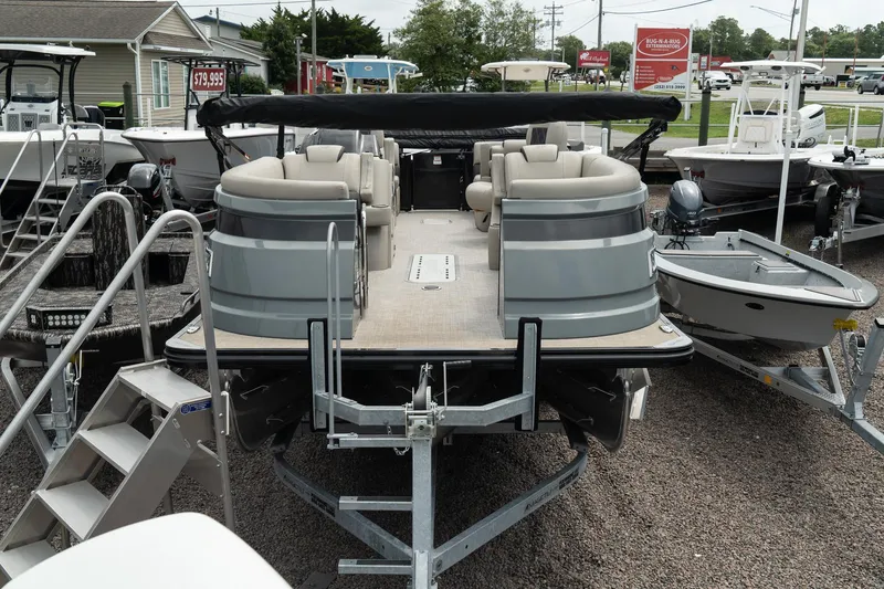 Slide: The Image of 2023 Silver Wave 2410 SW3 CLS pontoon boat on display at a dealership. - 3