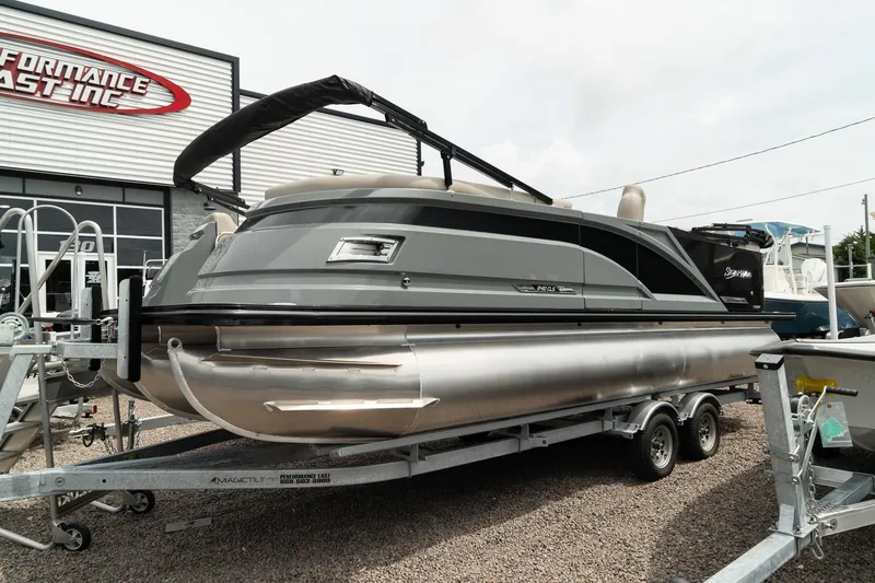 Slide: The Image of 2023 Silver Wave 2410 SW3 CLS pontoon boat on a trailer outside a dealership. - 5