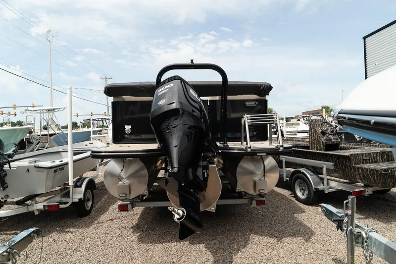 Slide: The Image of 2023 Silver Wave 2410 SW3 CLS pontoon boat with outboard motor, rear view. - 7