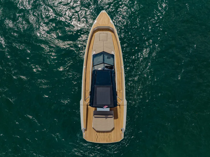 Slide: The Image of Top view of 2024 Evo Yachts R4 WA luxury boat on open water. - 10