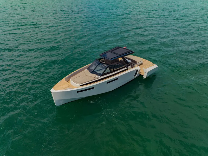 Slide: The Image of 2024 Evo Yachts R4 WA luxury yacht cruising on open water. - 11